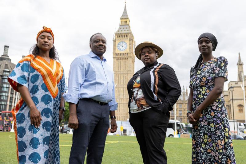 Group photo of Shelter Peer Researchers on Parliament Square with Big Ben in the background